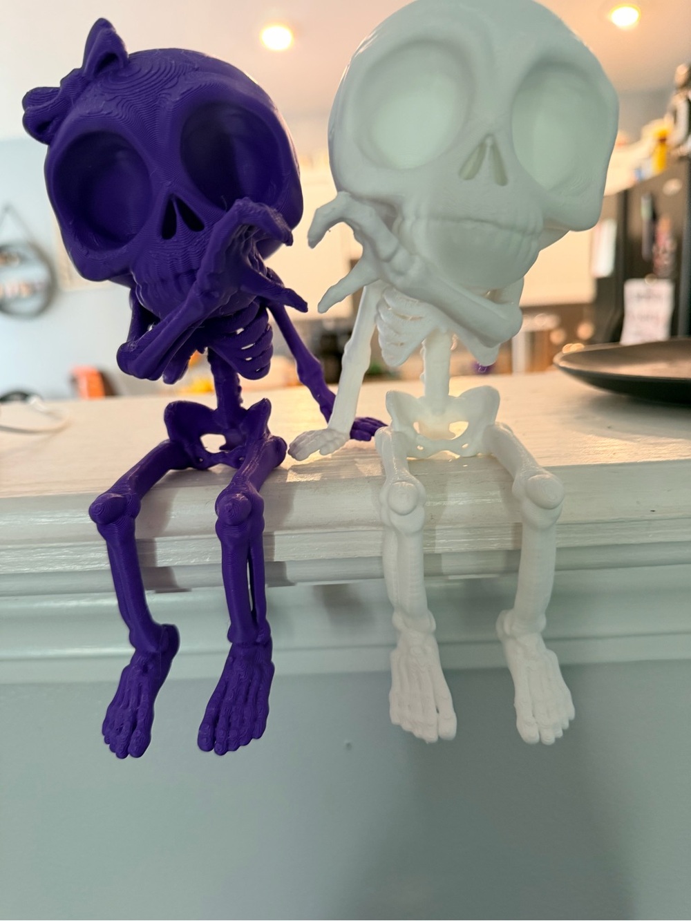 Decorative Skeleton Figurines - Purple and White Halloween Accents